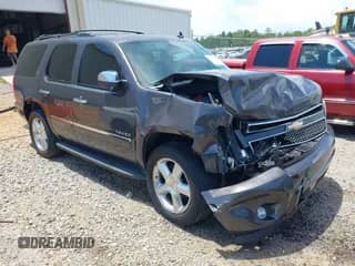 2011 Chevrolet Tahoe LTZ with VIN 1GNSCCE06BR106758, listed as a IAAI auction lot 42352896 with 149,594 mi miles and . Bid and sale history available at DreamBid. Image 1.