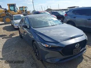 ✅ 2023 Mazda 3 S Carbon Edition • VIN: JM1BPBLM5P1610561 • Lot: 43312146. Listed on IAAI with 51,123 mi. Free auction sales archive from the USA and detailed vehicle history report at DreamBid. Image 1.
