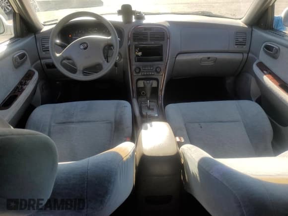 ✅ 2003 Kia Optima LX • VIN: KNAGD128X35205020 • Лот: 76521374. Опубликован ранее на Copart с пробегом 242 323 миль. Бесплатный доступ к архиву аукционных продаж из США и подробный отчёт об истории автомобиля на DreamBid. Изображение 8.