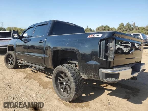 2015 Chevrolet Silverado 1500 LT with VIN 3GCUKREC1FG418428, listed as a Copart auction lot 84203845 with 116,745 mi miles and Salvage title. Bid and sale history available at DreamBid. Image 2.