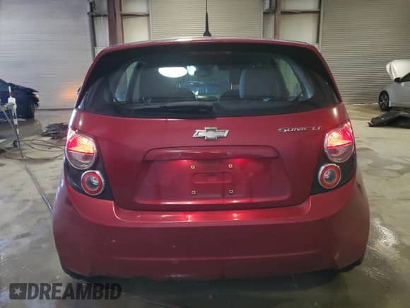 2013 Chevrolet Sonic LT с VIN 1G1JD6SH5D4130913, выставлен на аукционе Copart как лот 83786824 с пробегом 186 881 миль миль и Списание • Salvage title. История ставок и продаж доступна на DreamBid. Изображение 6.