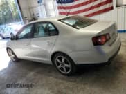 ✅ 2009 Volkswagen Jetta S • VIN: 3VWJZ71K99M010312 • Лот: 84917885. Опубликован ранее на Copart с пробегом 142 057 миль. Бесплатный доступ к архиву аукционных продаж из США и подробный отчёт об истории автомобиля на DreamBid. Изображение 2.