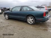 ✅ 1996 Oldsmobile Cutlass Supreme S • VIN: 1G3WH12M7TF330552 • Lot: 83843834. Listed on Copart with 111,819 mi. Free auction sales archive from the USA and detailed vehicle history report at DreamBid. Image 2.