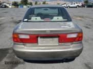 ✅ 1998 Mazda Protege DX • VIN: JM1BC1414W0203670 • Лот: 62966544. Опубликован ранее на Copart с пробегом 249 405 миль. Бесплатный доступ к архиву аукционных продаж из США и подробный отчёт об истории автомобиля на DreamBid. Изображение 6.