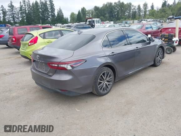 2022 Toyota Camry Hybrid XLE with VIN 4T1F31AK6NU575433, listed as a IAAI auction lot 42841689 with 65,526 mi miles and . Bid and sale history available at DreamBid. Image 4.