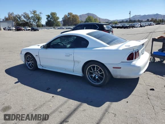 ✅ 1998 Ford Mustang GT • VIN: 1FAFP42X9WF179805 • Lot: 82494395. Listed on Copart with 142,724 mi. Free auction sales archive from the USA and detailed vehicle history report at DreamBid. Image 2.