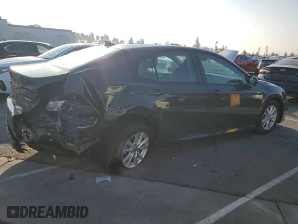 2025 Toyota Camry LE with VIN 4T1DAACK8SU067003, listed as a Copart auction lot 84061975 with 9,394 mi miles and Salvage title. Bid and sale history available at DreamBid. Image 3.