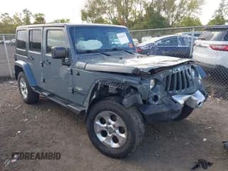 ✅ 2015 Jeep Wrangler Unlimited Sahara • VIN: 1C4HJWEG2FL651887 • Lot: 43282344. Listed on IAAI with 145,503 mi. Free auction sales archive from the USA and detailed vehicle history report at DreamBid. Image 1.