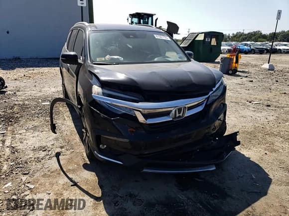 ✅ 2020 Honda Pilot Touring 7-Passenger • VIN: 5FNYF5H65LB009516 • Lot: 81001735. Listed on Copart with 66,757 mi. Free auction sales archive from the USA and detailed vehicle history report at DreamBid. Image 14.