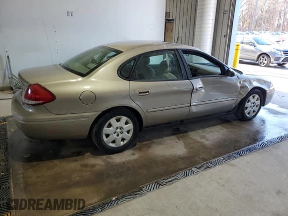 ✅ 2004 Ford Taurus LX • VIN: 1FAFP52UX4G134052 • Lot: 78477514. Listed on Copart with 106,990 mi. Free auction sales archive from the USA and detailed vehicle history report at DreamBid. Image 3.