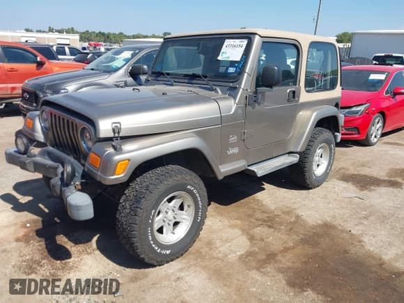✅ 2004 Jeep Wrangler Sahara • VIN: 1J4FA59S74P718659 • Lot: 43316154. Listed on IAAI with 144,737 mi. Free auction sales archive from the USA and detailed vehicle history report at DreamBid. Image 17.