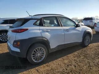 ✅ 2018 Hyundai Kona SEL • VIN: KM8K22AA0JU088656 • Лот: 77535684. Опубликован ранее на Copart с пробегом 100 988 миль. Бесплатный доступ к архиву аукционных продаж из США и подробный отчёт об истории автомобиля на DreamBid. Изображение 3.
