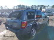 ✅ 1999 Jeep Grand Cherokee Laredo • VIN: 1J4GW58S1XC520727 • Lot: 43730318. Wystawiony na IAAI z przebiegiem 154 356 mil. Bezpłatny archiwum sprzedaży aukcyjnych z USA i szczegółowy raport historii pojazdu na DreamBid. Zdjęcie 6.