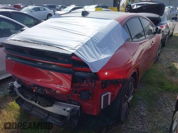 2024 Toyota Prius LE with VIN JTDACAAU0R3037645, listed as a IAAI auction lot 43323280 with 19,611 mi miles and . Bid and sale history available at DreamBid. Image 4.