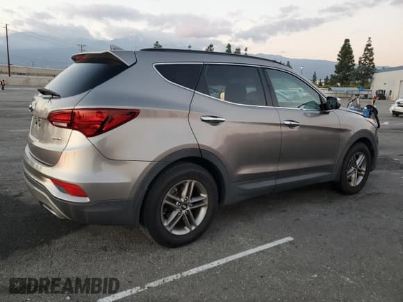 ✅ 2018 Hyundai Santa Fe 2.4L • VIN: 5NMZU3LB0JH056211 • Lot: 93690255. Listed on Copart with 75,202 mi. Free auction sales archive from the USA and detailed vehicle history report at DreamBid. Image 3.