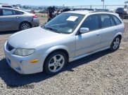 ✅ 2002 Mazda Protege • VIN: JM1BJ245821501352 • Lot: 42619327. Listed on IAAI with 235,130 mi. Free auction sales archive from the USA and detailed vehicle history report at DreamBid. Image 2.