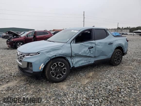 2024 Hyundai Santa Cruz SEL z VIN 5NTJBDDE3RH101529, wystawiony jako Copart lot #79864154 z przebiegiem 2 272 mil mil oraz Szkoda całkowita • Salvage title. Historia ofert i sprzedaży dostępna na DreamBid. Obrazek 1.