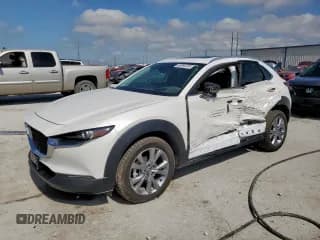 ✅ 2022 Mazda CX-30 S Premium • VIN: 3MVDMBDL6NM458473 • Лот: 66364035. Опубликован ранее на Copart с пробегом 64 305 миль. Бесплатный доступ к архиву аукционных продаж из США и подробный отчёт об истории автомобиля на DreamBid. Изображение 1.