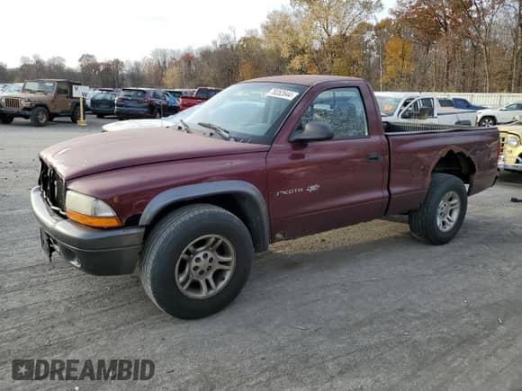2002 Dodge Dakota z VIN 1B7FL16X22S668515, wystawiony jako Copart lot #78352644 z przebiegiem 214 222 mil mil oraz Szkoda całkowita • Salvage title. Historia ofert i sprzedaży dostępna na DreamBid. Obrazek 1.