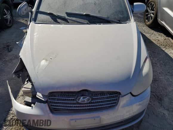 2007 Hyundai Accent GLS z VIN KMHCN46CX7U102105, wystawiony jako Copart lot #65793504 z przebiegiem 213 972 mil mil oraz Szkoda całkowita • Salvage title. Historia ofert i sprzedaży dostępna na DreamBid. Obrazek 12.