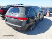 ✅ 2014 Honda Odyssey Touring • VIN: 5FNRL5H99EB051715 • Lot: 43405838. Listed on IAAI with 176,921 mi. Free auction sales archive from the USA and detailed vehicle history report at DreamBid. Image 4.