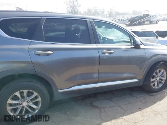 ✅ 2019 Hyundai Santa Fe SE • VIN: 5NMS23AD8KH105961 • Лот: 43603685. Опубликован ранее на IAAI с пробегом 156 396 миль. Бесплатный доступ к архиву аукционных продаж из США и подробный отчёт об истории автомобиля на DreamBid. Изображение 13.