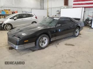✅ 1985 Pontiac Firebird Trans Am • VIN: 1G2FW87H0FL653359 • Lot: 51024685. Listed on Copart with 57,695 mi. Free auction sales archive from the USA and detailed vehicle history report at DreamBid. Image 1.