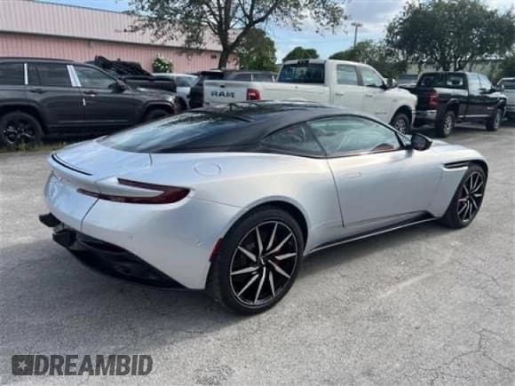 ✅ 2021 Aston Martin DB11 V8 • VIN: SCFRMFAWXMGL10429 • Lot: 57315395. Listed on Copart with 1,737 mi. Free auction sales archive from the USA and detailed vehicle history report at DreamBid. Image 4.