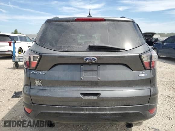 2018 Ford Escape SE z VIN 1FMCU9GD6JUD48647, wystawiony jako Copart lot #70868345 z przebiegiem 102 072 mil mil oraz Szkoda całkowita • Salvage title. Historia ofert i sprzedaży dostępna na DreamBid. Obrazek 6.