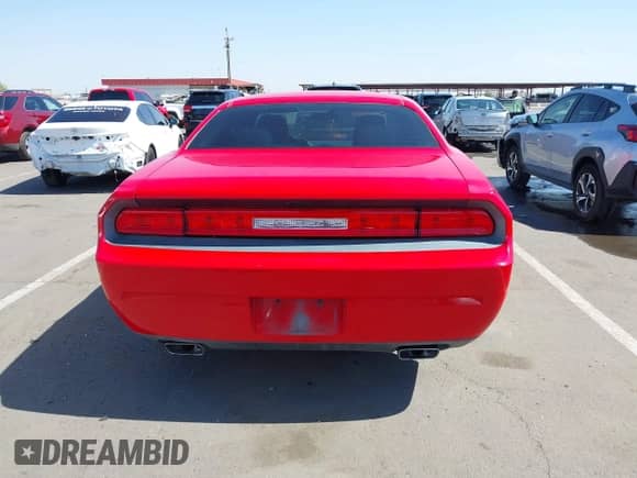 2014 Dodge Challenger SXT 100th Anniversary with VIN 2C3CDYAG1EH313481, listed as a IAAI auction lot 42460067 with 209,125 mi miles and . Bid and sale history available at DreamBid. Image 16.