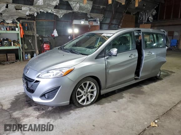 ✅ 2014 Mazda 5 Touring • VIN: JM1CW2CL2E0172180 • Lot: 92789175. Listed on Copart with 92,976 mi. Free auction sales archive from the USA and detailed vehicle history report at DreamBid. Image 1.