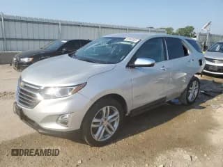 ✅ 2020 Chevrolet Equinox Premier • VIN: 2GNAXYEX0L6206085 • Лот: 67983855. Опубликован ранее на Copart с пробегом 97 011 миль. Бесплатный доступ к архиву аукционных продаж из США и подробный отчёт об истории автомобиля на DreamBid. Изображение 1.