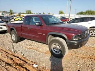 2002 Dodge Dakota z VIN 1B7GG12XX2S570878, wystawiony jako Copart lot #75023704 z przebiegiem 109 421 mil mil oraz Szkoda całkowita • Salvage title. Historia ofert i sprzedaży dostępna na DreamBid. Obrazek 4.