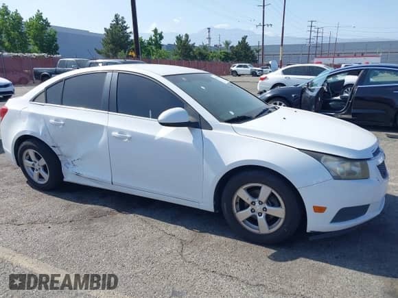 2012 Chevrolet Cruze 1FL z VIN 1G1PE5SC9C7231004, wystawiony jako IAAI lot #42572353 z przebiegiem 124 344 mil mil oraz . Historia ofert i sprzedaży dostępna na DreamBid. Obrazek 1.