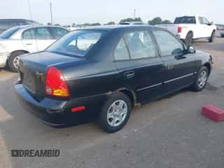 2005 Hyundai Accent GLS z VIN KMHCG45C55U587584, wystawiony jako IAAI lot #42864972 z przebiegiem 122 849 mil mil oraz . Historia ofert i sprzedaży dostępna na DreamBid. Obrazek 4.