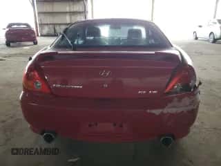2003 Hyundai Tiburon GT z VIN KMHHN65F53U086483, wystawiony jako Copart lot #53391495 z przebiegiem 153 544 mil mil oraz Szkoda całkowita • Salvage title. Historia ofert i sprzedaży dostępna na DreamBid. Obrazek 6.