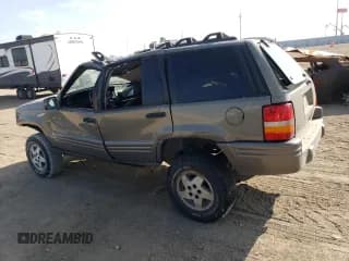✅ 1998 Jeep Grand Cherokee Limited • VIN: 1J4GZ78Y2WC146974 • Лот: 71435484. Опубликован ранее на Copart с пробегом 192 996 миль. Бесплатный доступ к архиву аукционных продаж из США и подробный отчёт об истории автомобиля на DreamBid. Изображение 2.