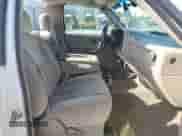 2004 Chevrolet Silverado 1500 z VIN 1GCEC14T74Z342991, wystawiony jako Copart lot #60379065 z przebiegiem 207 477 mil mil oraz Czysty tytuł • Clean title. Historia ofert i sprzedaży dostępna na DreamBid. Obrazek 10.