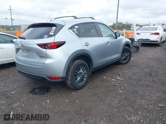 ✅ 2017 Mazda CX-5 Touring • VIN: JM3KFBCL6H0198854 • Lot: 43555680. Listed on IAAI with 130,367 mi. Free auction sales archive from the USA and detailed vehicle history report at DreamBid. Image 4.
