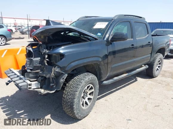 ✅ 2019 Toyota Tacoma SR • VIN: 3TMCZ5AN0KM262580 • Lot: 42509090. Listed on IAAI with 96,438 mi. Free auction sales archive from the USA and detailed vehicle history report at DreamBid. Image 2.