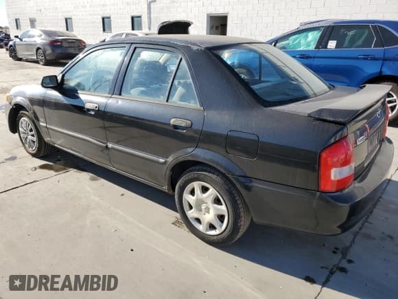 ✅ 2000 Mazda Protege DX • VIN: JM1BJ2220Y0239835 • Lot: 80228864. Wystawiony na Copart z przebiegiem 200 936 mil. Bezpłatny archiwum sprzedaży aukcyjnych z USA i szczegółowy raport historii pojazdu na DreamBid. Zdjęcie 2.