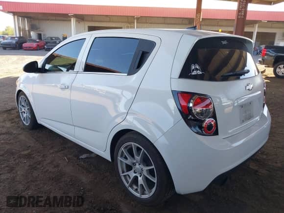 2013 Chevrolet Sonic LT with VIN 1G1JD6SBXD4222966, listed as a IAAI auction lot 42575707 with 140,605 mi miles and . Bid and sale history available at DreamBid. Image 3.