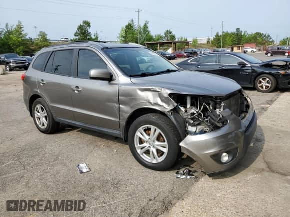 2012 Hyundai Santa Fe Limited с VIN 5XYZK3AB6CG166623, выставлен на аукционе Copart как лот 54138514 с пробегом 119 550 миль миль и Списание • Salvage title. История ставок и продаж доступна на DreamBid. Изображение 4.