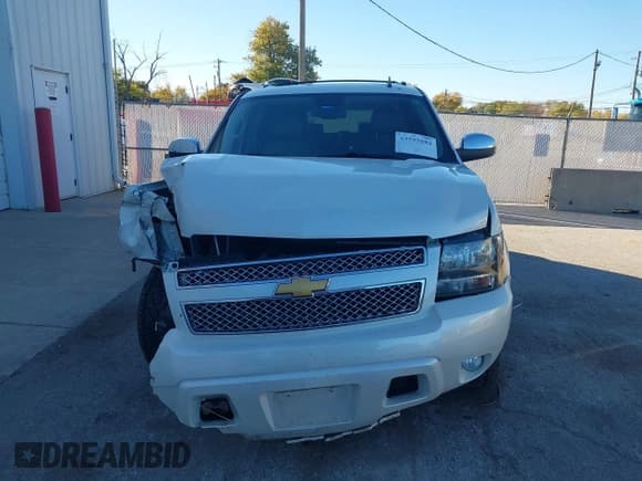 ✅ 2014 Chevrolet Suburban LTZ • VIN: 1GNSKKE7XER142130 • Lot: 43595884. Listed on IAAI with 165,414 mi. Free auction sales archive from the USA and detailed vehicle history report at DreamBid. Image 12.