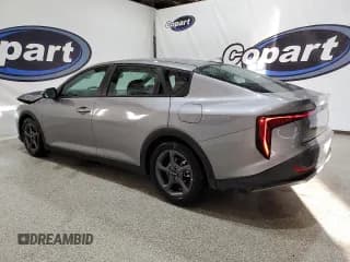 ✅ 2025 Kia K4 LXS • VIN: 3KPFT4DE0SE078481 • Лот: 93752545. Опубликован ранее на Copart с пробегом 23 618 миль. Бесплатный доступ к архиву аукционных продаж из США и подробный отчёт об истории автомобиля на DreamBid. Изображение 2.