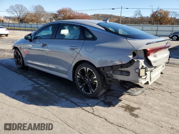 ✅ 2021 Kia K5 GT-Line • VIN: 5XXG64J20MG002873 • Лот: 91670635. Опубликован ранее на Copart с пробегом 94 509 миль. Бесплатный доступ к архиву аукционных продаж из США и подробный отчёт об истории автомобиля на DreamBid. Изображение 2.