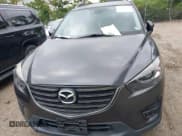 ✅ 2016 Mazda CX-5 Grand Touring • VIN: JM3KE2DY6G0840159 • Lot: 43179646. Wystawiony na IAAI z przebiegiem 71 500 mil. Bezpłatny archiwum sprzedaży aukcyjnych z USA i szczegółowy raport historii pojazdu na DreamBid. Zdjęcie 12.