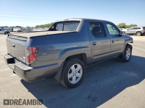✅ 2014 Honda Ridgeline RTL • VIN: 5FPYK1F57EB005668 • Lot: 80218335. Listed on Copart with 142,165 mi. Free auction sales archive from the USA and detailed vehicle history report at DreamBid. Image 3.