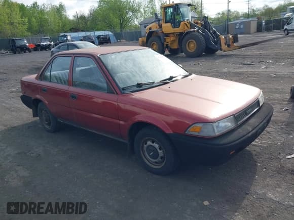✅ 1990 Toyota Corolla • VIN: JT2AE91AXL3318396 • Lot: 42186060. Listed on IAAI with 128,403 mi. Free auction sales archive from the USA and detailed vehicle history report at DreamBid. Image 1.