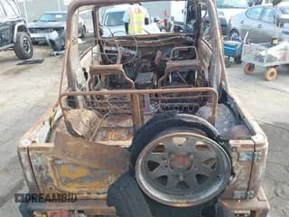 ✅ 1987 Suzuki Samurai • VIN: JS4JC51C3H4189102 • Lot: 42715087. Wystawiony na IAAI z przebiegiem Nie podano. Bezpłatny archiwum sprzedaży aukcyjnych z USA i szczegółowy raport historii pojazdu na DreamBid. Zdjęcie 6.